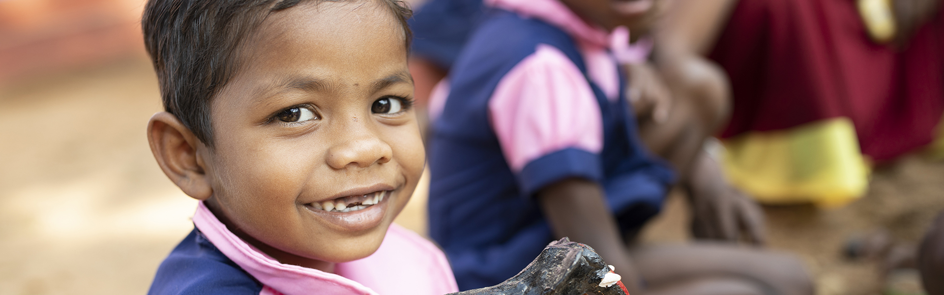 Child Smiling, blue shirt